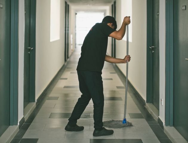 a-hotel-room-service-cleaning-the-floor-2024-12-06-00-04-43-utc